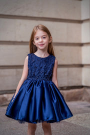 Dark Blue Satin Girls’ dress embellished with a ribbon