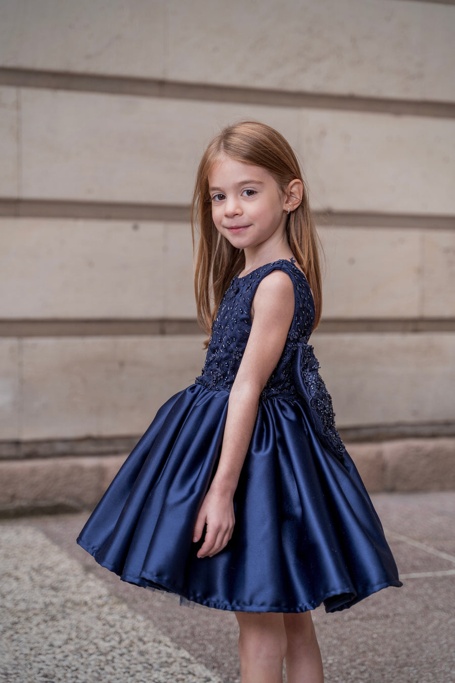 Dark Blue Satin Girls’ dress embellished with a ribbon