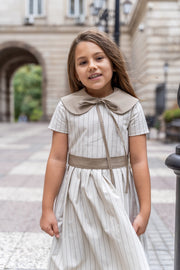 Girl’s cotton dress in a soft cream shade