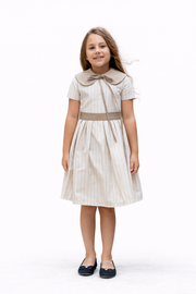 Girl’s cotton dress in a soft cream shade