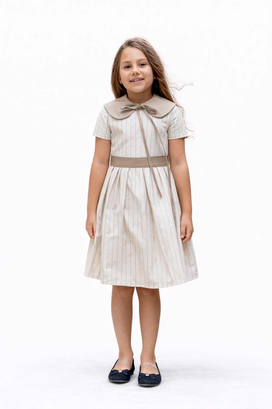 Girl’s cotton dress in a soft cream shade