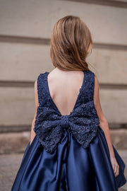 Dark Blue Satin Girls’ dress embellished with a ribbon