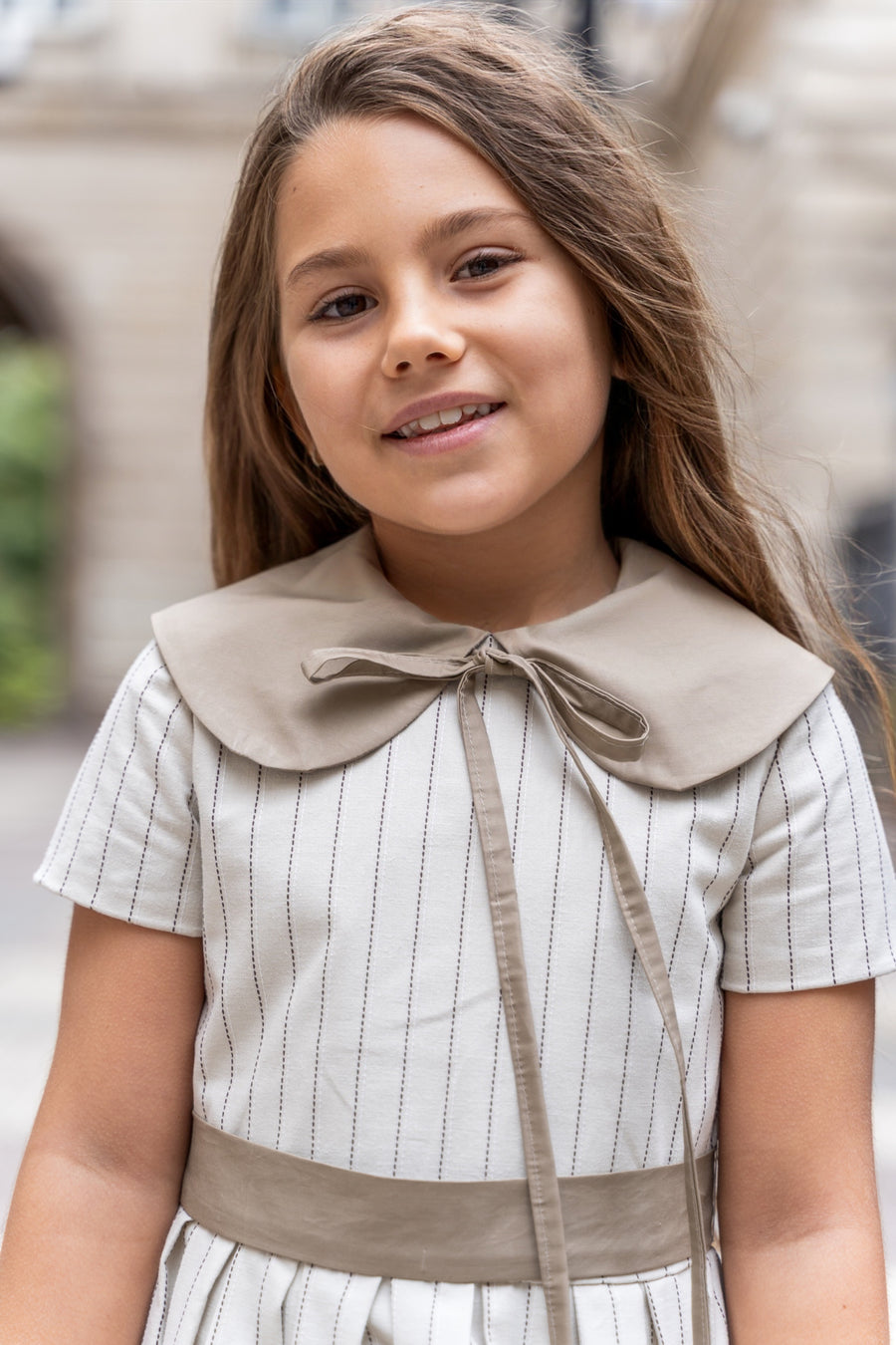 Girl’s cotton dress in a soft cream shade