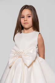 White satin dress with pearl embellished ribbon