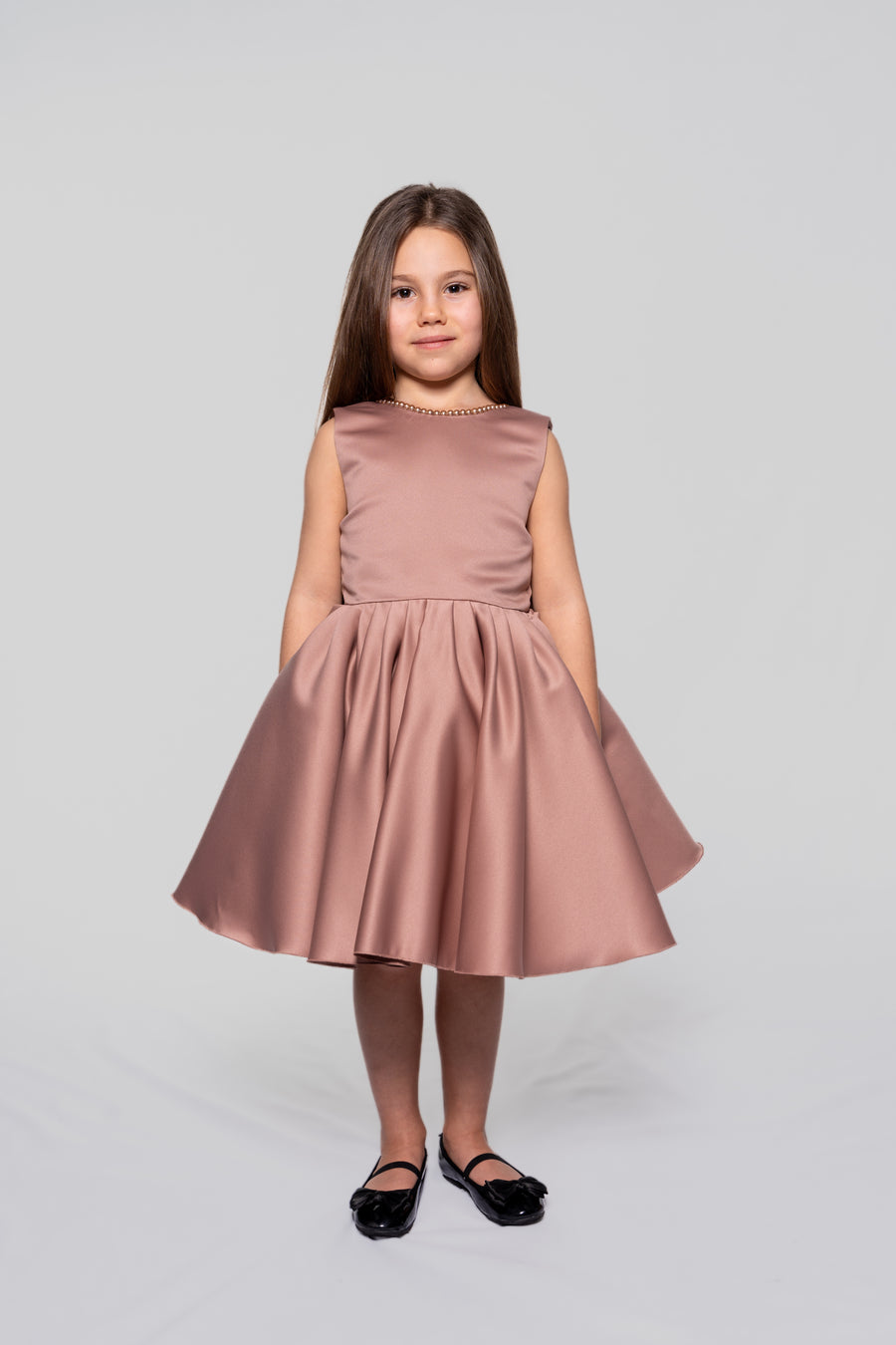 Ash rose satin dress embellished with pearls and a ribbon
