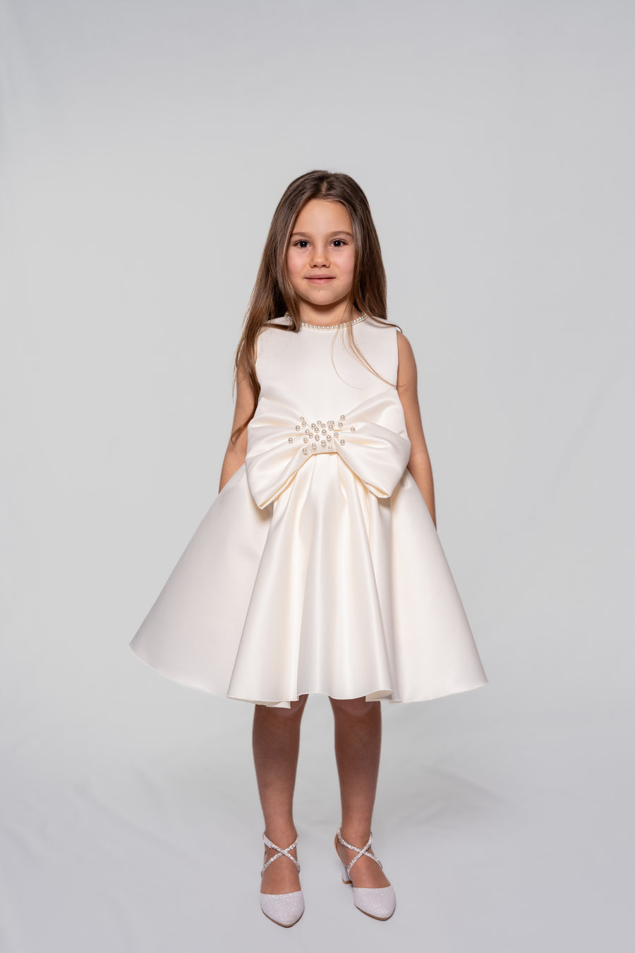 White satin dress with pearl embellished ribbon